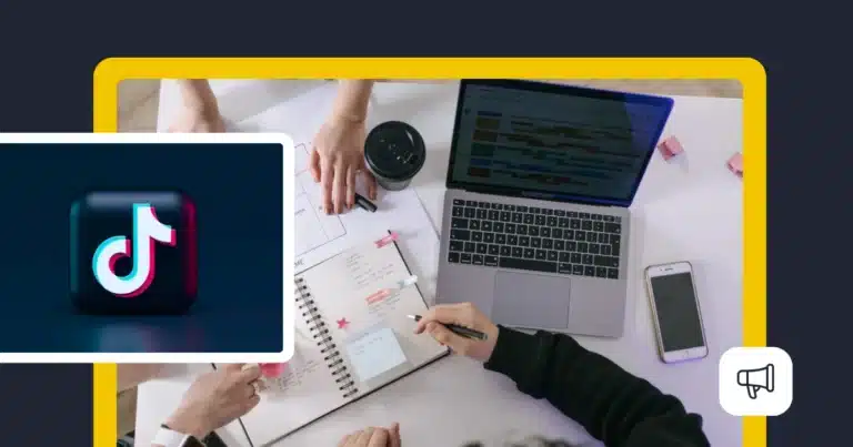 Team planning a TikTok content strategy around a laptop and notebook, with the TikTok logo displayed alongside a social media content calendar.