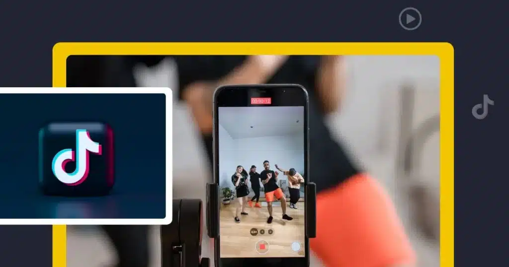 Promotional graphic about TikTok marketing. A smartphone mounted on a tripod records a group of people dancing in a bright indoor room, illustrating short-form video creation. A large TikTok logo appears in an inset image on the left, while a TikTok icon is displayed on the right side of the design. The scene is framed by a bold yellow border against a dark blue background, emphasizing TikTok content creation and social media engagement.