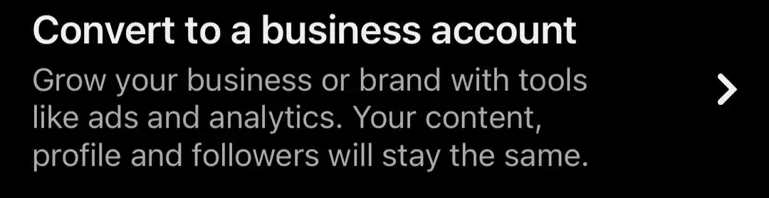 Pinterest settings screen showing the option to convert a personal account into a business account. The message explains that users can access business tools such as advertising and analytics while keeping their existing content, profile information, and followers unchanged. A navigation arrow indicates the next step in the account conversion process.