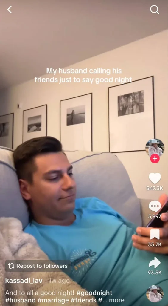 Man lying on a couch holding a phone, with text overlay saying 'My husband calling his friends just to say good night.