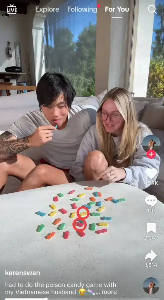 A man and a woman  playing a game with colorful gummy candies on a table, with red circles highlighting specific candies.
