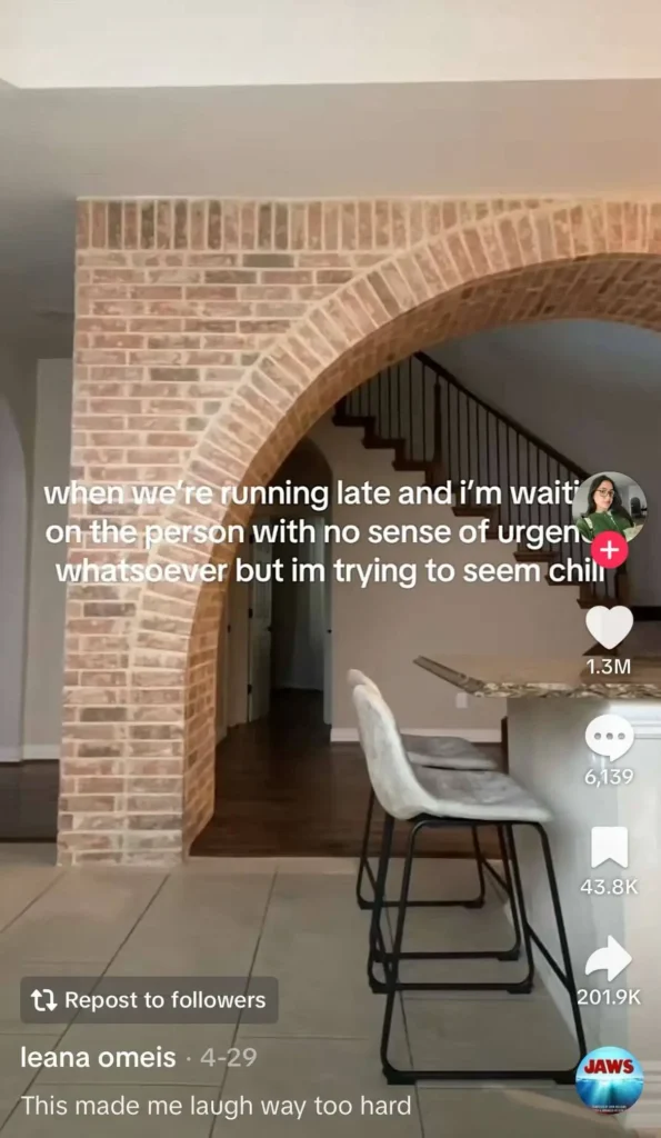 An interior space with a brick archway leading to a staircase. There is text overlaid on the image that reads, "when we're running late and I'm waitin' on the person with no sense of urgency whatsoever but im trying to seem chill."