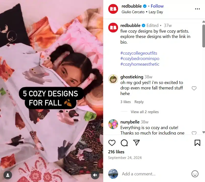 A cozy fall-themed reel showing a girl snuggled under a colorful animal-printed blanket. Text overlay says “5 cozy designs for fall,” promoting seasonal prints by five independent artists.