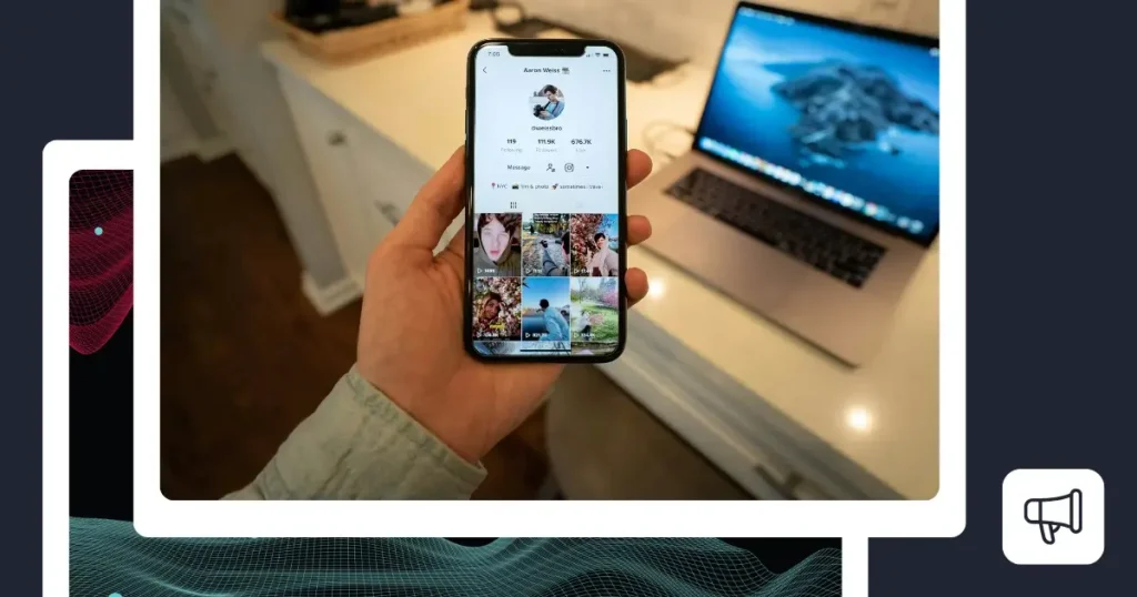 Person holding a smartphone showing a TikTok profile.