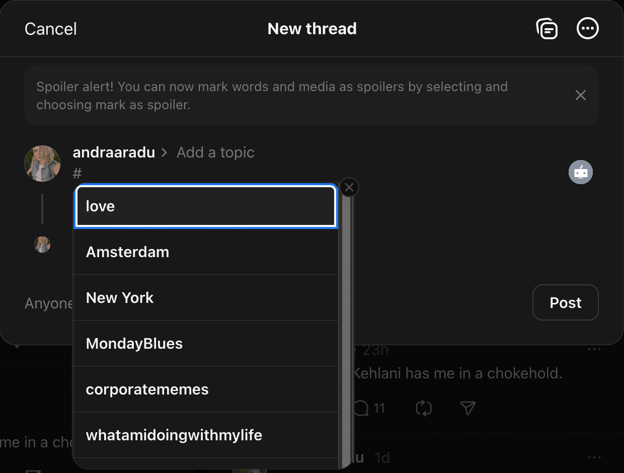 A Threads new post screen showing the hashtag dropdown menu after typing ‘#’, with suggested tags like love, Amsterdam, New York, MondayBlues, corporatememes, and whatamidoingwithmylife.