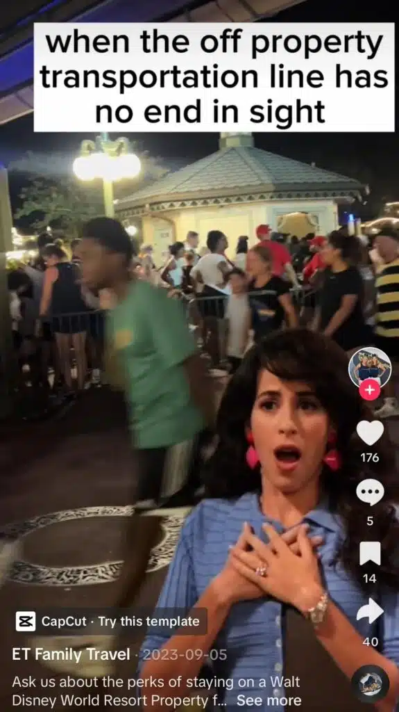 TikTok video from ET Family Travel showing a crowded nighttime transportation line at Disney, with a shocked woman in the foreground and the caption “when the off property transportation line has no end in sight.”