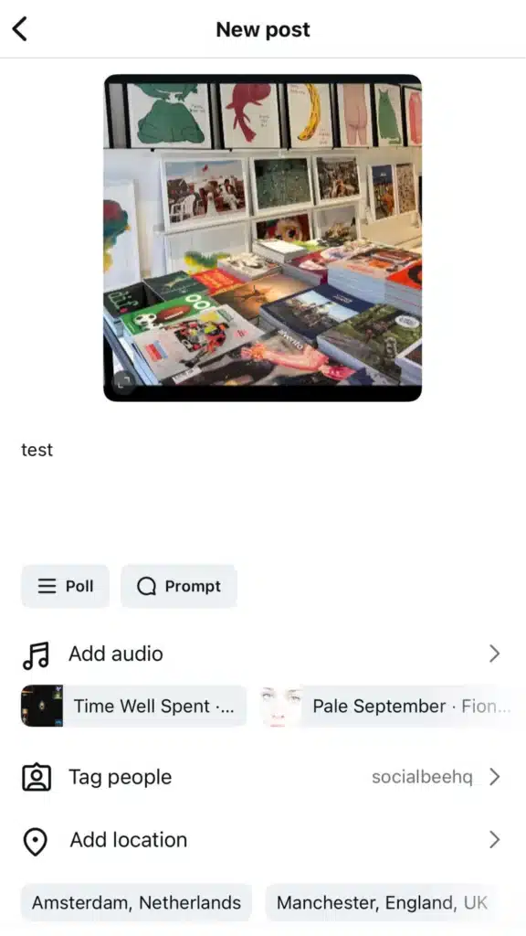 Instagram new post creation screen with a preview image of books and posters, text caption “test,” and options to add poll, prompt, audio, tag people, and add location.