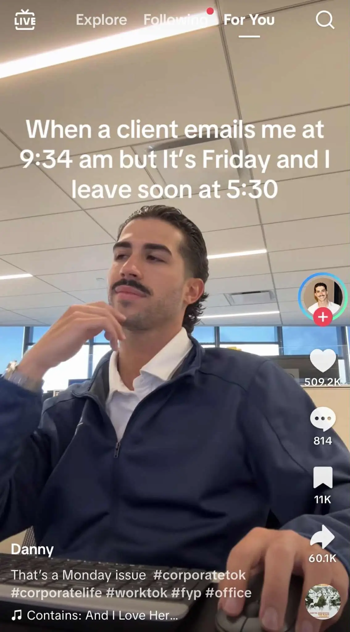 TikTok video of a man in an office sitting at his desk with a smug expression. Overlay text reads: ‘When a client emails me at 9:34 am but it’s Friday and I leave soon at 5:30.