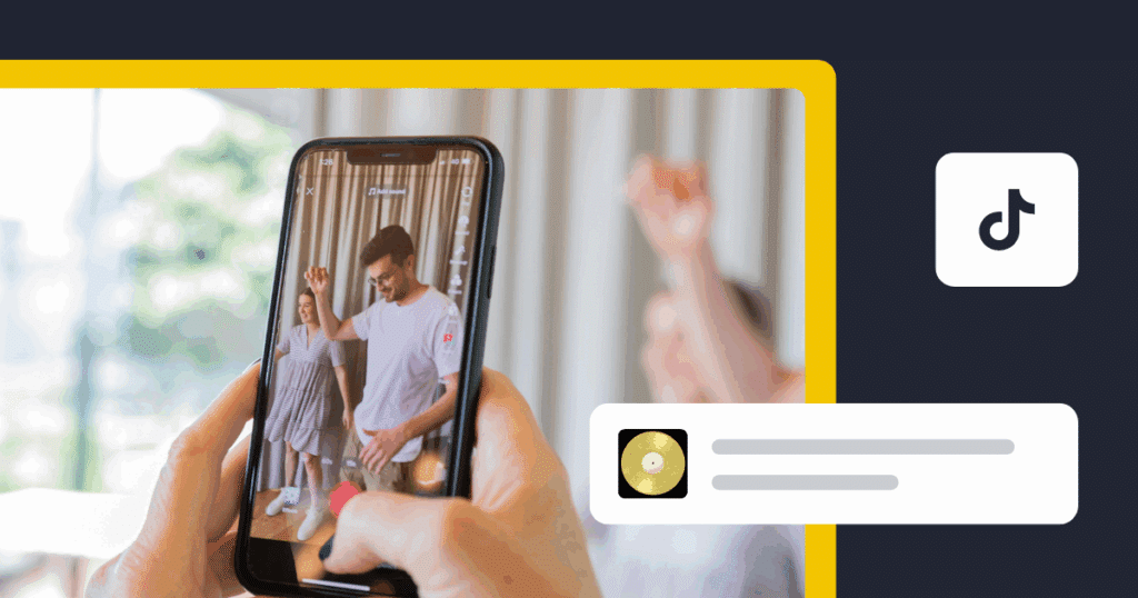 Person recording a TikTok video on a smartphone, showing two people dancing indoors with the TikTok logo overlay
