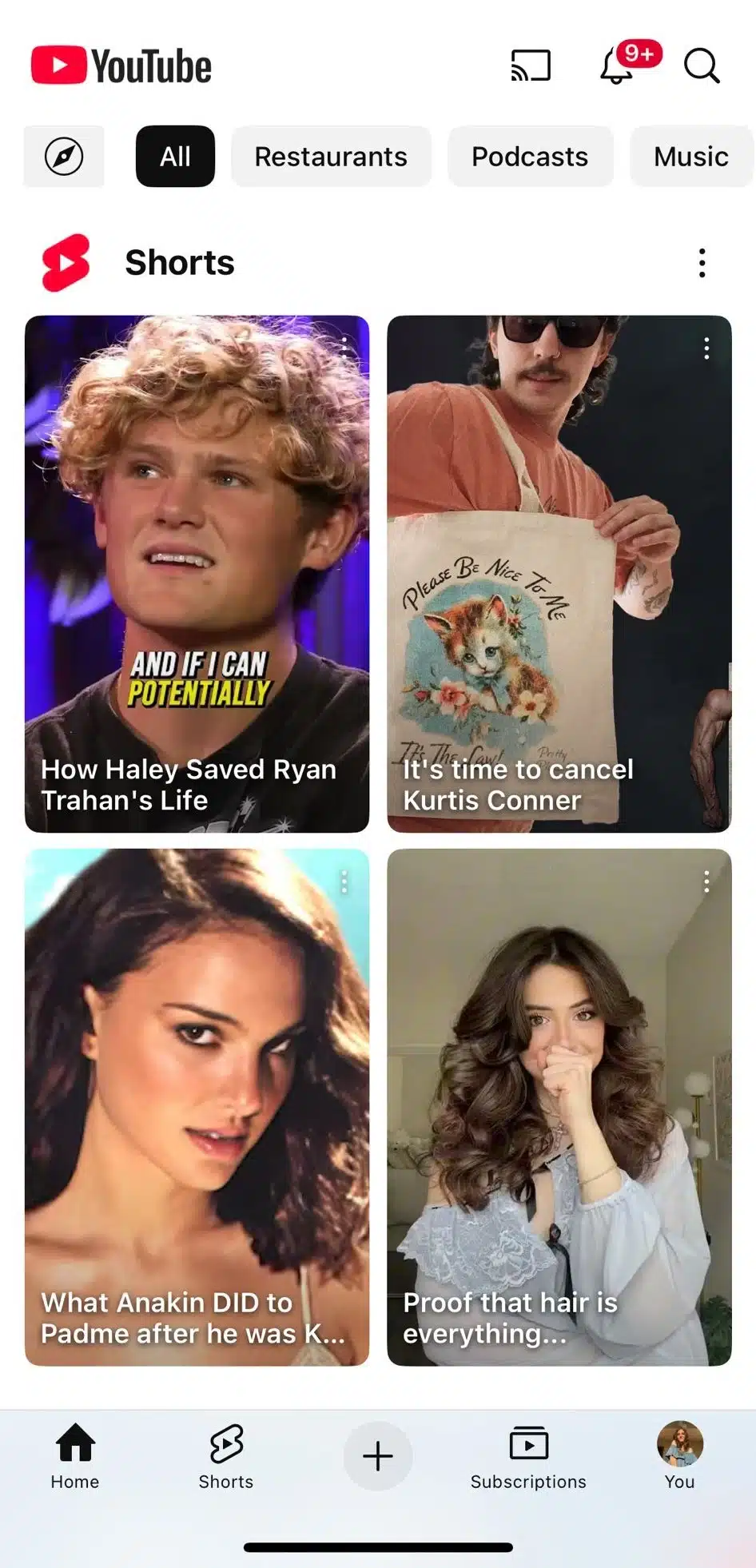 YouTube mobile Shorts feed displaying four video thumbnails with titles: a blond man reacting ("How Haley Saved Ryan Trahan's Life"), a man holding a cat-printed tote bag ("It's time to cancel Kurtis Conner"), a close-up of a woman ("What Anakin DID to Padme after he was K..."), and a woman showing off her hairstyle ("Proof that hair is everything...").