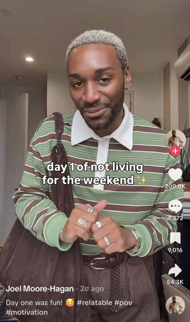 A person smiling at the camera wearing a green and brown striped shirt with text on the image that reads, “day 1 of not living for the weekend."