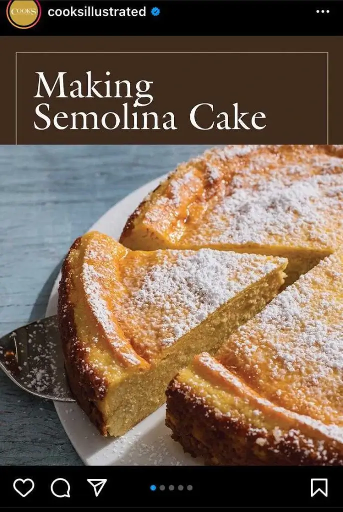 A close-up of a golden semolina cake dusted with powdered sugar, with one slice being lifted out on a cake server. The top of the image features the text "Making Semolina Cake."