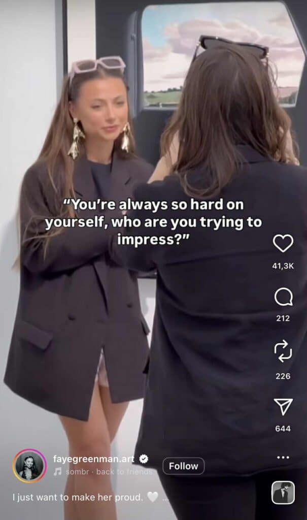 Instagram Reel showing two women in conversation, with one wearing oversized earrings and sunglasses on her head. The on-screen caption reads, “You’re always so hard on yourself, who are you trying to impress?”