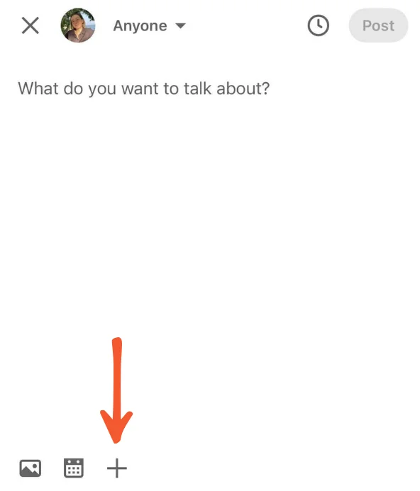 A LinkedIn post composer screen with the prompt “What do you want to talk about?” and an orange arrow pointing to the plus (+) icon in the bottom toolbar.