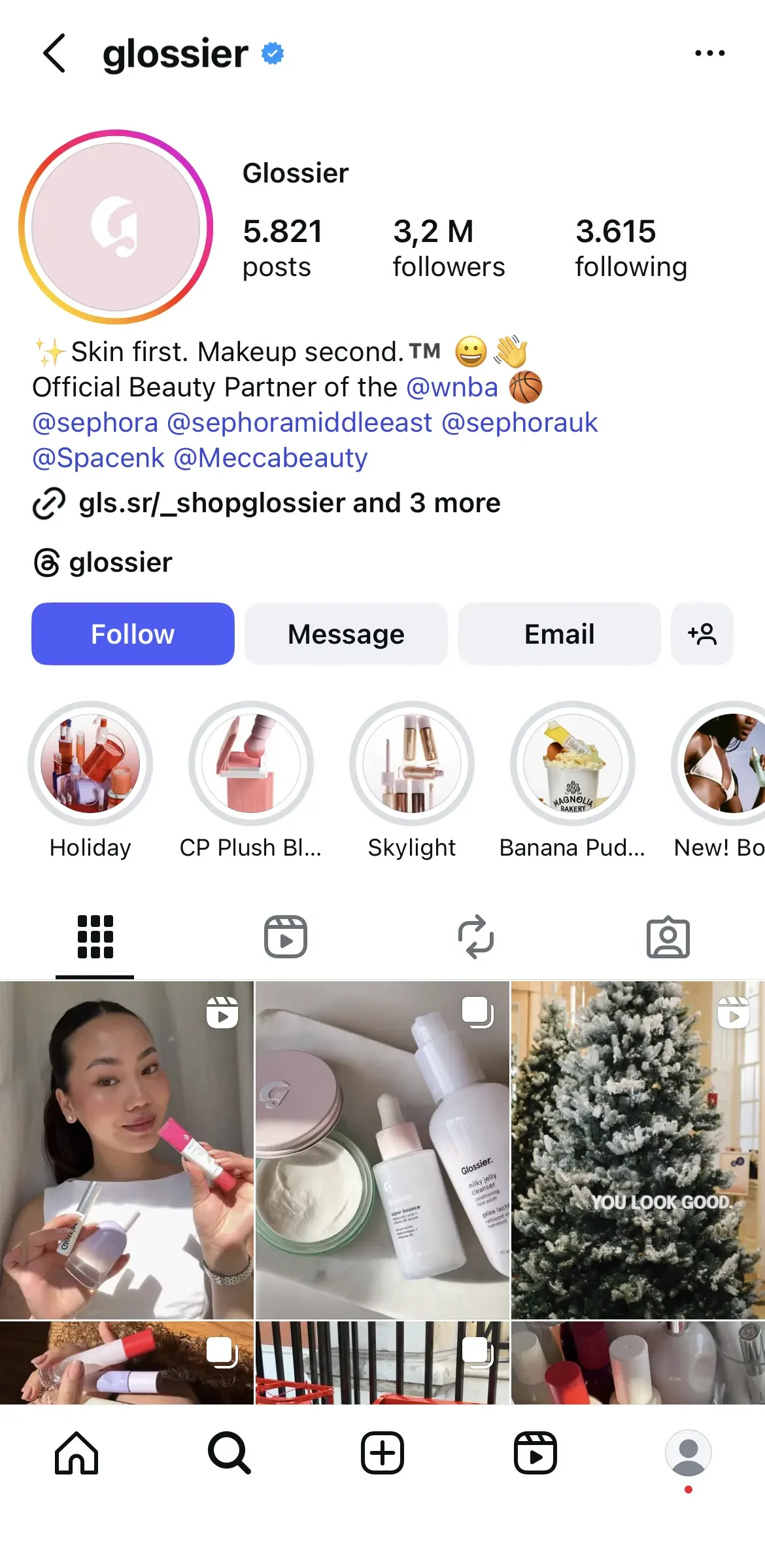 Instagram profile for beauty brand Glossier, highlighting a skincare-first tagline, partner mentions, and story highlights for product collections, with a grid of posts featuring models using Glossier makeup, product flat lays, and a holiday tree with branding.