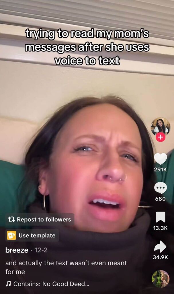 A woman lies in bed squinting in confusion at her phone, with on-screen text saying “trying to read my mom’s messages after she uses voice to text.”