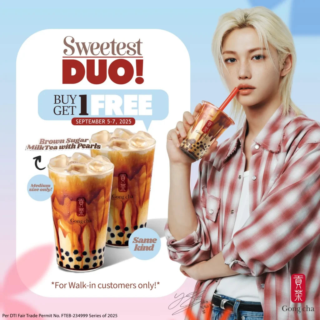 A person holding a cup of brown sugar milk tea with pearls next to a “buy one get one free” Gong Cha promotion featuring two iced bubble tea drinks.