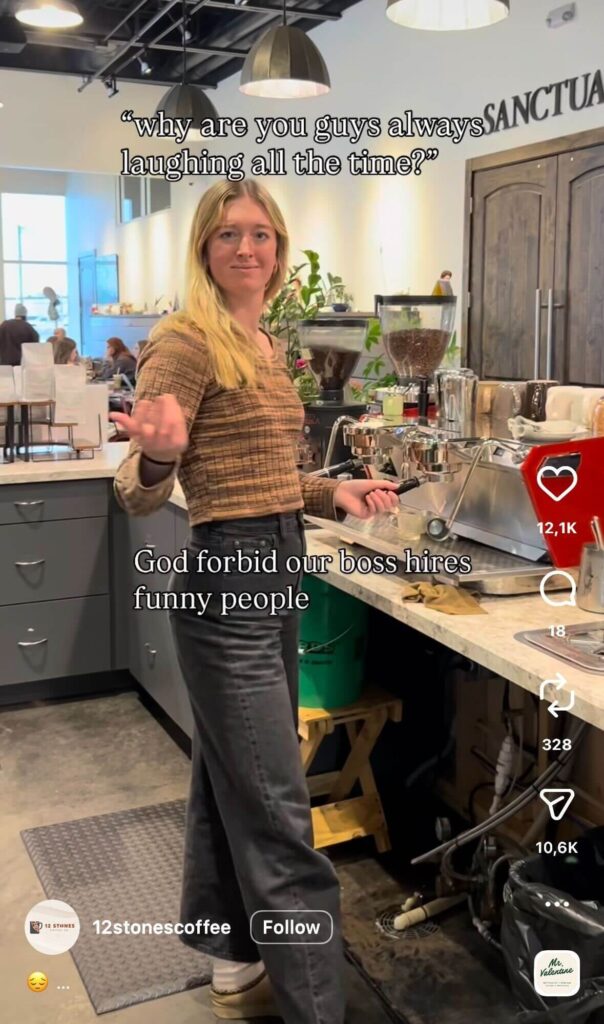 A barista stands behind an espresso machine in a café, gesturing with one hand. Text reads, “why are you guys always laughing all the time?” followed by “God forbid our boss hires funny people.”