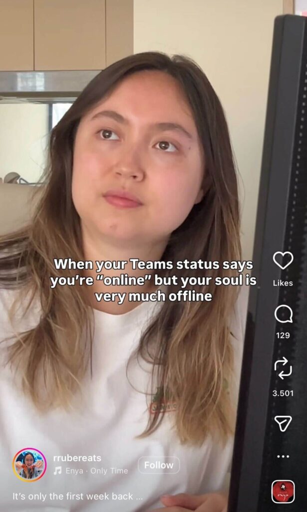 A woman sits at a desk staring off to the side, looking tired, with a computer monitor beside her. Text reads, “When your Teams status says you’re ‘online’ but your soul is very much offline.”