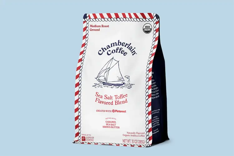 A bag of Chamberlain Coffee Sea Salt Toffee flavored blend with illustrated packaging, shown against a light blue background as part of a Pinterest collaboration.