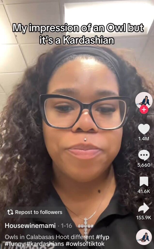 Woman wearing glasses looks into the camera with a neutral expression; on-screen text reads, “My impression of an Owl but it’s a Kardashian.”