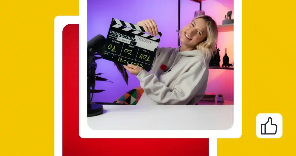 Smiling female content creator in a home studio holding a film clapperboard next to a microphone, with colorful lighting in the background.