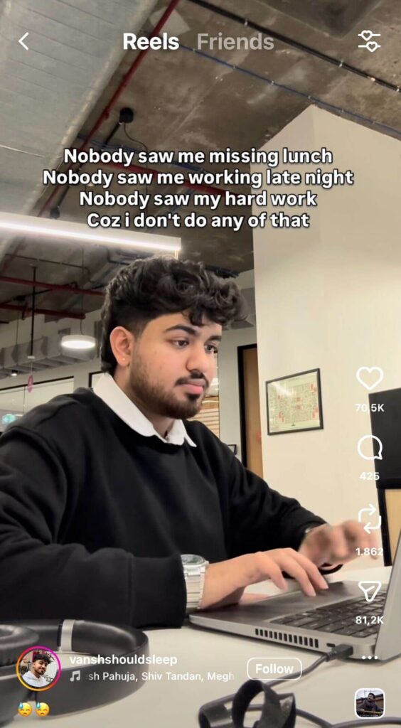 Instagram Reel of a man typing on a laptop in an office. On-screen text reads, “Nobody saw me missing lunch. Nobody saw me working late night. Nobody saw my hard work. Coz I don’t do any of that.” Instagram interface icons are visible on the side.