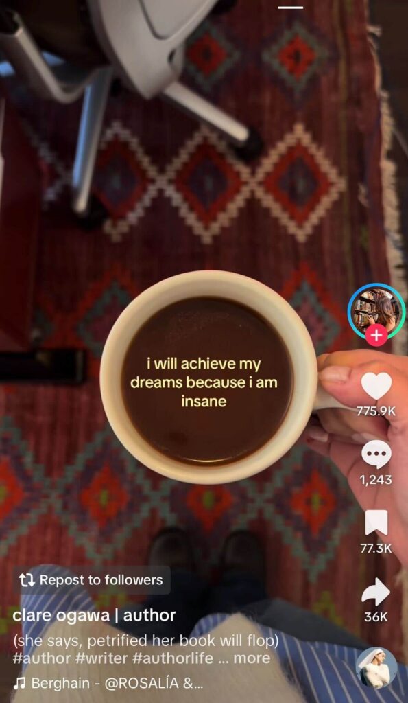 TikTok video showing a hand holding a cup of coffee with the overlaid text “i will achieve my dreams because i am insane,” displayed in the standard TikTok interface.