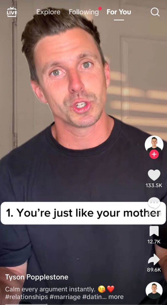Screenshot from a TikTok video featuring a man in a black shirt speaking directly to the camera indoors. On-screen text reads, “1. You’re just like your mother,” with likes, comments, and share icons displayed along the right side.