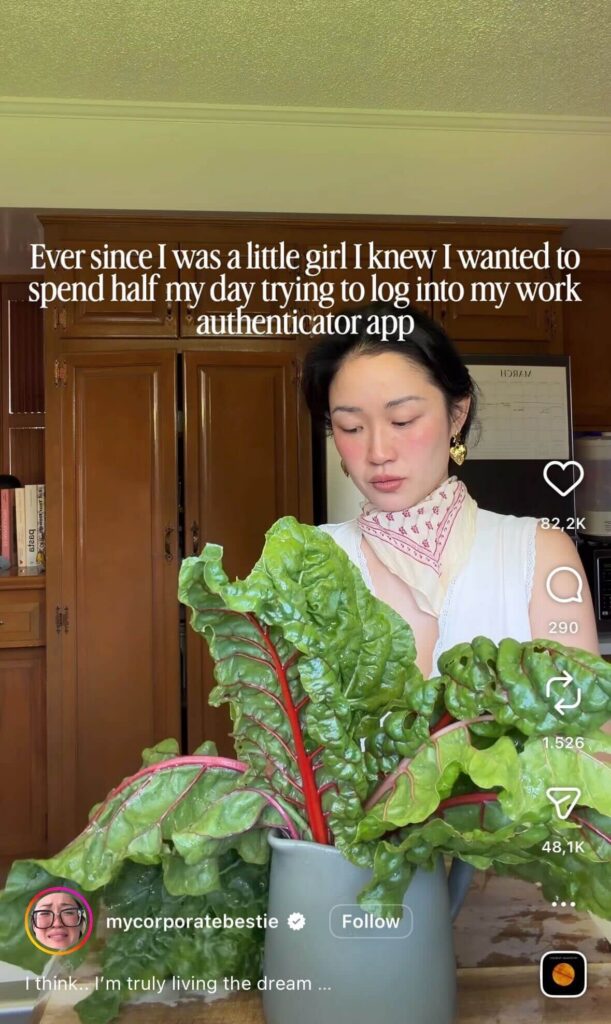 Woman in a kitchen holding large leafy greens (Swiss chard) with wooden cabinets in the background; overlaid text reads “Ever since I was a little girl I knew I wanted to spend half my day trying to log into my work authenticator app.”