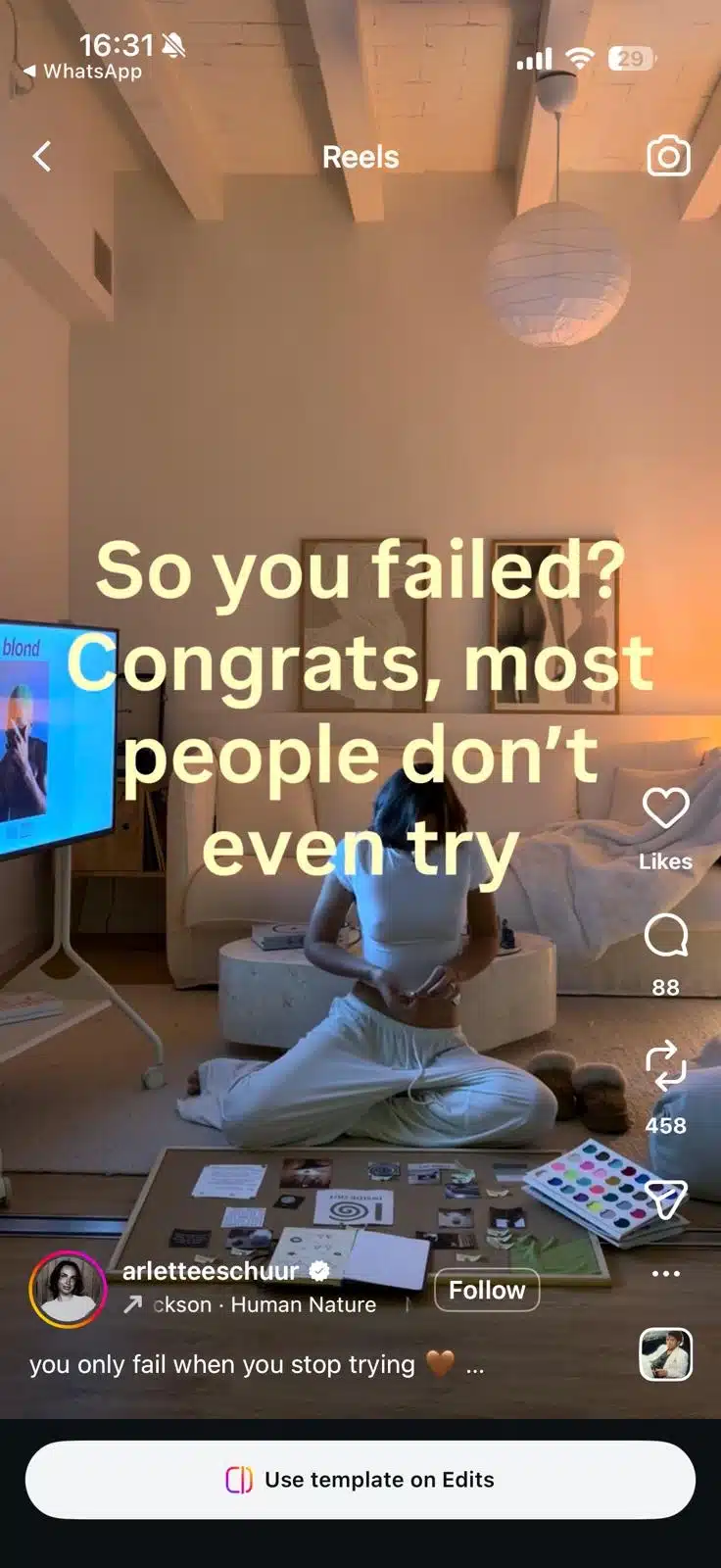 Instagram Reel showing a woman sitting on the floor in a softly lit living room working on a vision board, with motivational text reading, “So you failed? Congrats, most people don’t even try.”