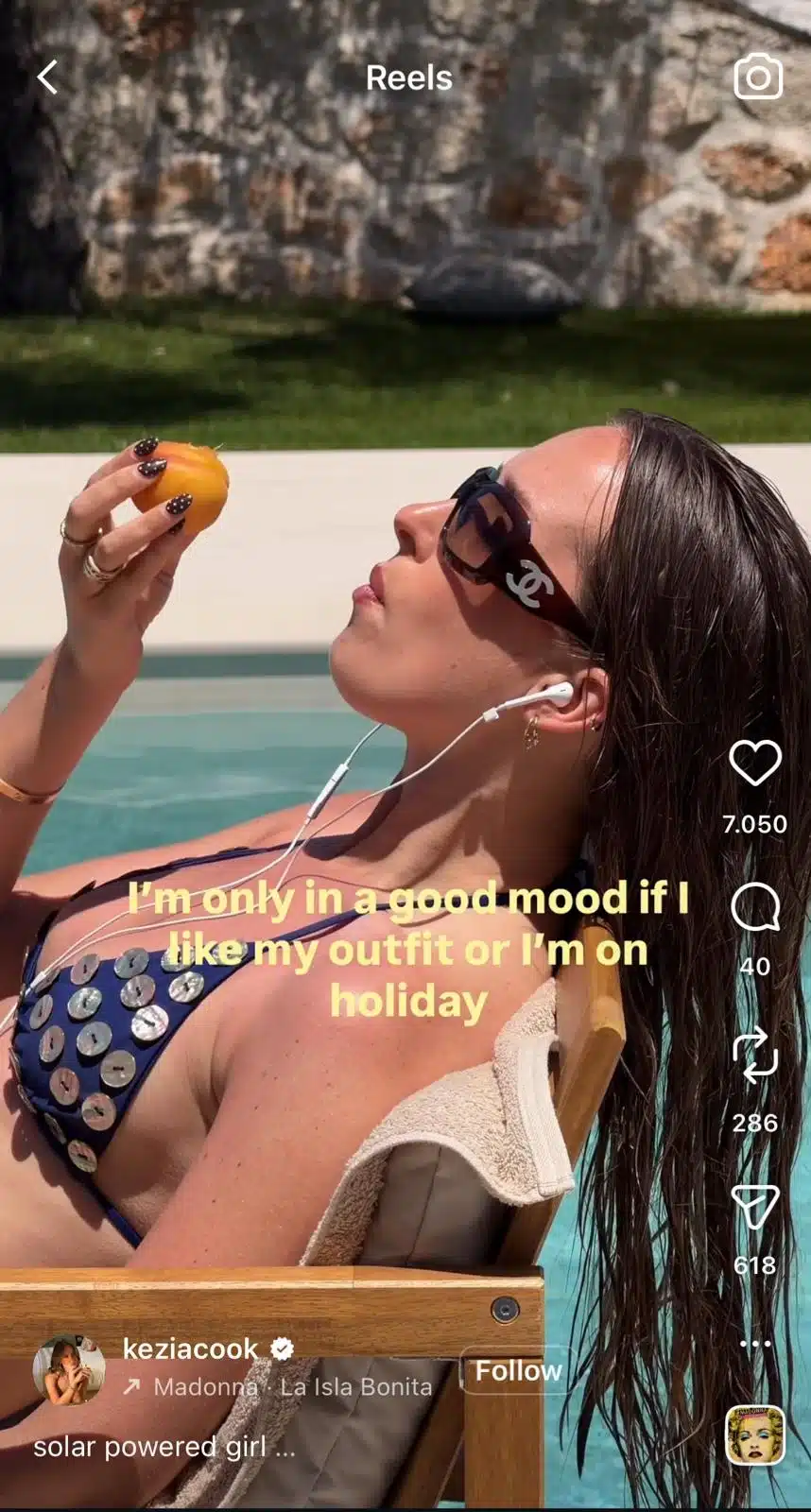 Instagram Reel showing a woman relaxing by a swimming pool in sunglasses and a bikini, holding a peach while listening to music, with text saying she is only in a good mood when she likes her outfit or is on holiday.