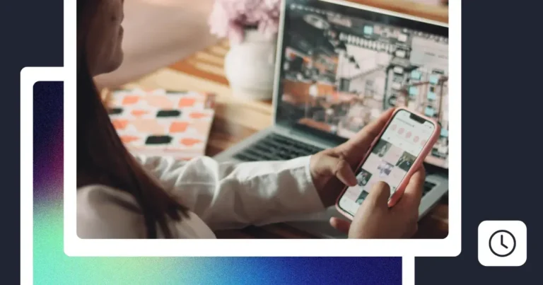 Person using a smartphone and laptop to manage and schedule social media content from a home workspace.