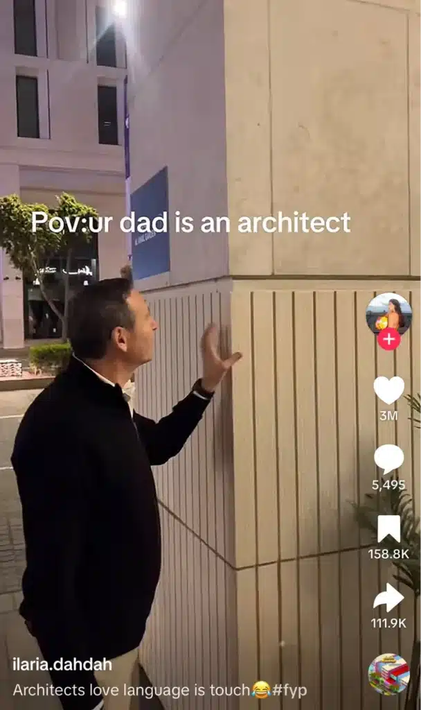 Viral TikTok video captioned “POV: your dad is an architect,” showing a man touching and inspecting architectural wall materials outdoors.