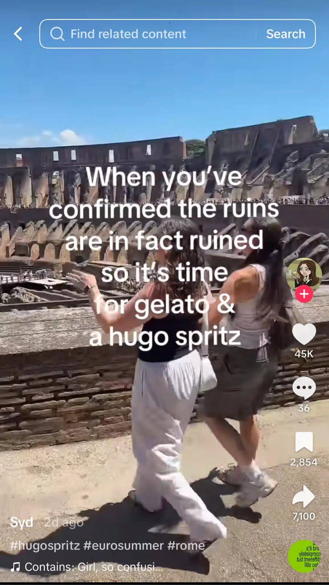 Two women walk past ancient stone ruins on a sunny day. One wears white wide-leg pants and a black tank top, while the other wears a gray skirt and white tank top. Large white text over the video reads, “When you’ve confirmed the ruins are in fact ruined so it’s time for gelato & a hugo spritz.”