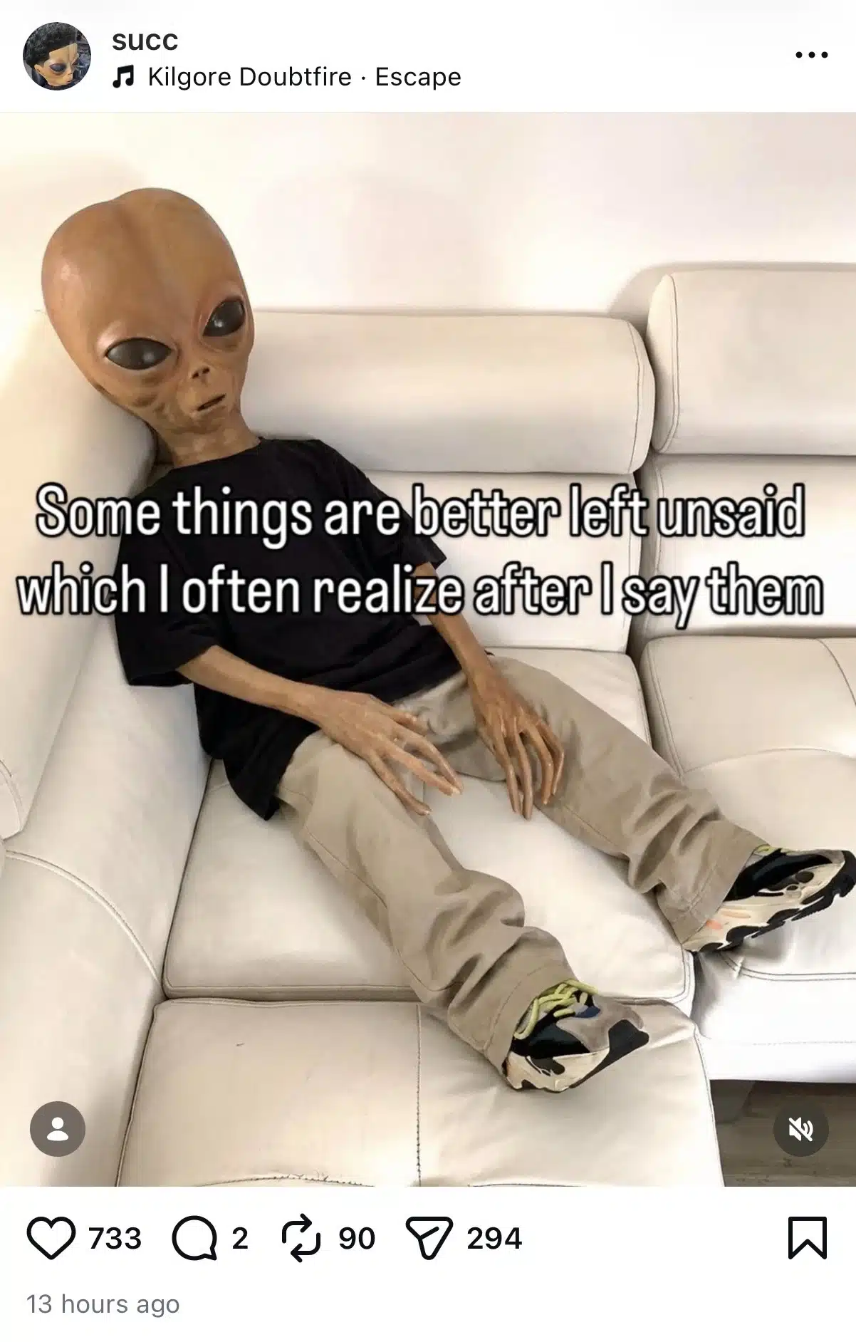 Instagram meme post showing an alien character sitting slouched on a white couch wearing a black T-shirt, beige pants, and sneakers. Overlaid text reads, “Some things are better left unsaid which I often realize after I say them.” The post appears on the account “succ” and uses the song “Escape” by Kilgore Doubtfire.