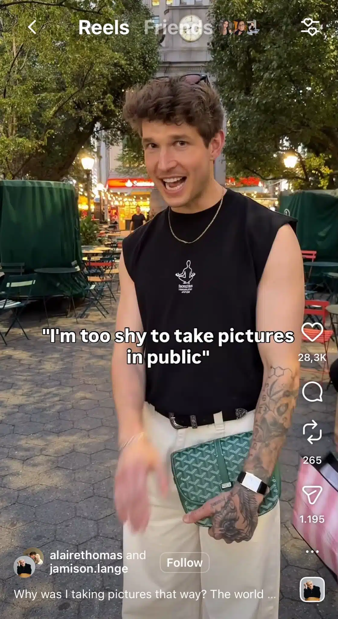Instagram Reel from @alairethomas and @jamison.lange showing a man standing in a public square with on-screen text reading “I’m too shy to take pictures in public,” and the Reel interface displaying engagement metrics and follow button.