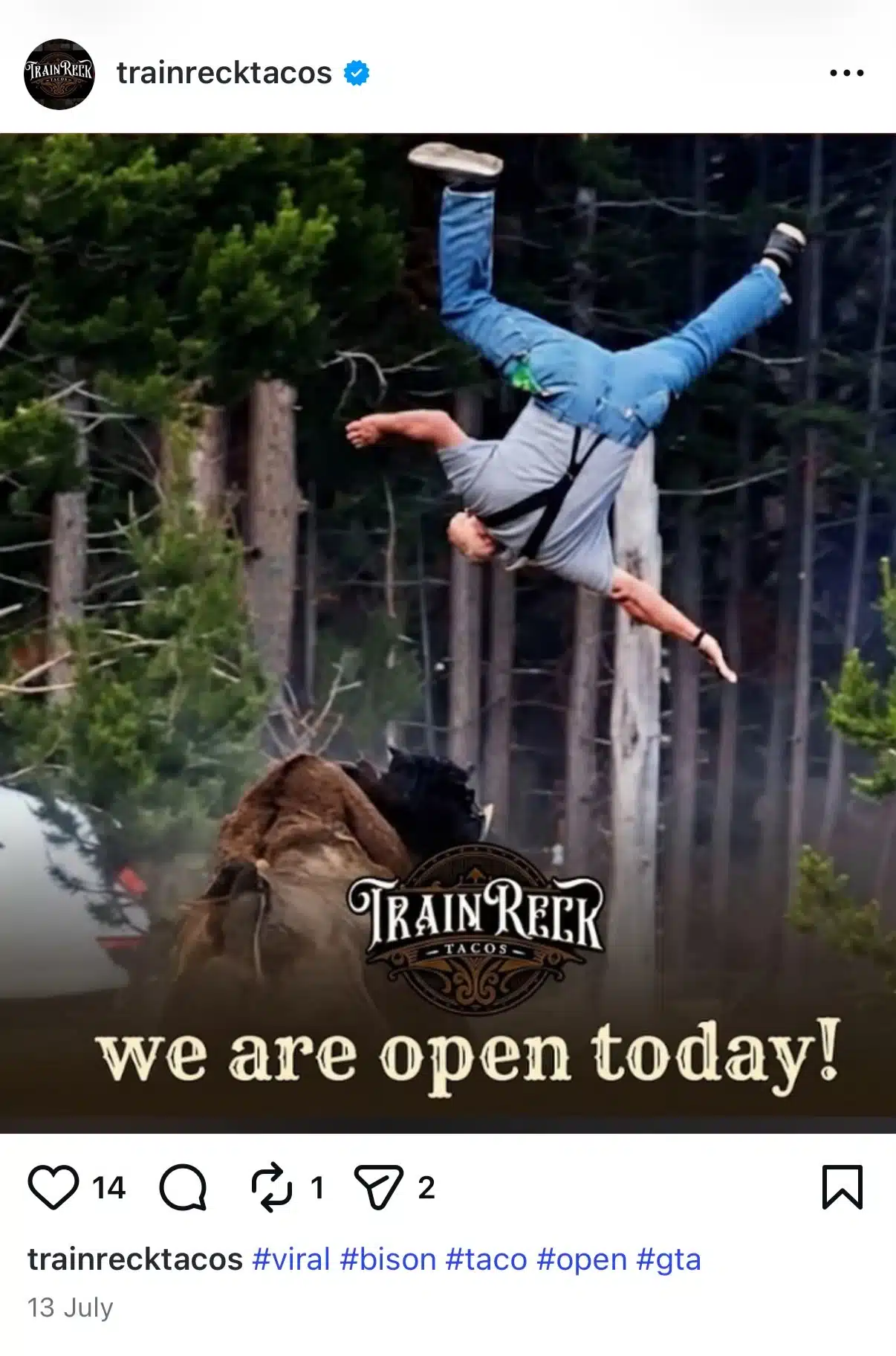 Instagram post from Train Wreck Tacos using a viral image of a person being tossed into the air by a bison. The post humorously overlays the image with the text, "we are open today!" to announce the restaurant is open.