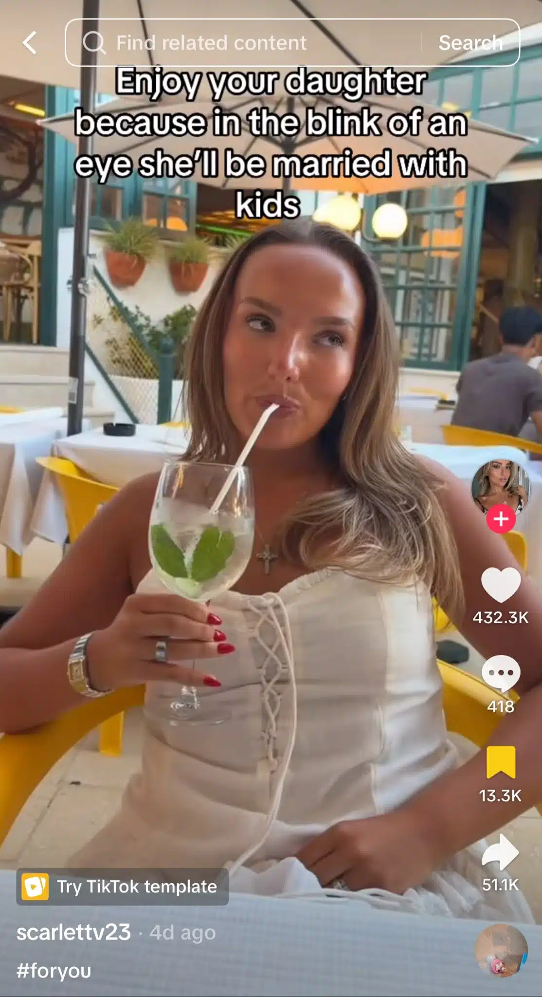 TikTok video showing a woman sitting at an outdoor restaurant holding a drink. Large text at the top reads, "Enjoy your daughter because in the blink of an eye she'll be married with kids."