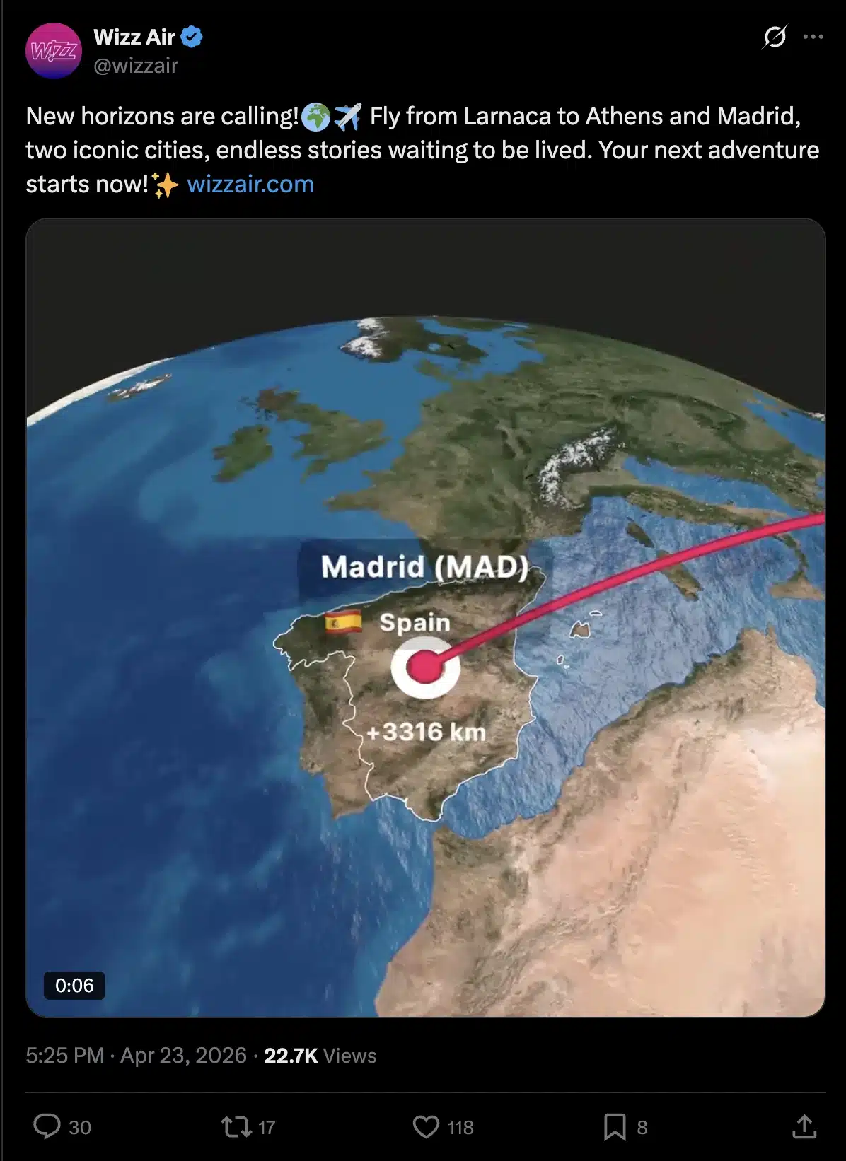 Screenshot of a post on X from Wizz Air announcing new flight routes from Larnaca to Athens and Madrid. The post includes a promotional video thumbnail showing a map of Europe with a highlighted flight path to Madrid, Spain.