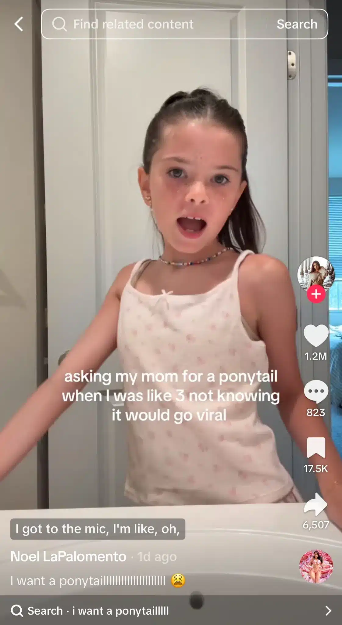 TikTok video of a young creator standing in a bathroom and lip-syncing to Beyoncé's "Partition." The on-screen text reads, "asking my mom for a ponytail when I was like 3 not knowing it would go viral," illustrating the viral trend where creators use the audio to humorously reflect on unexpected childhood moments.