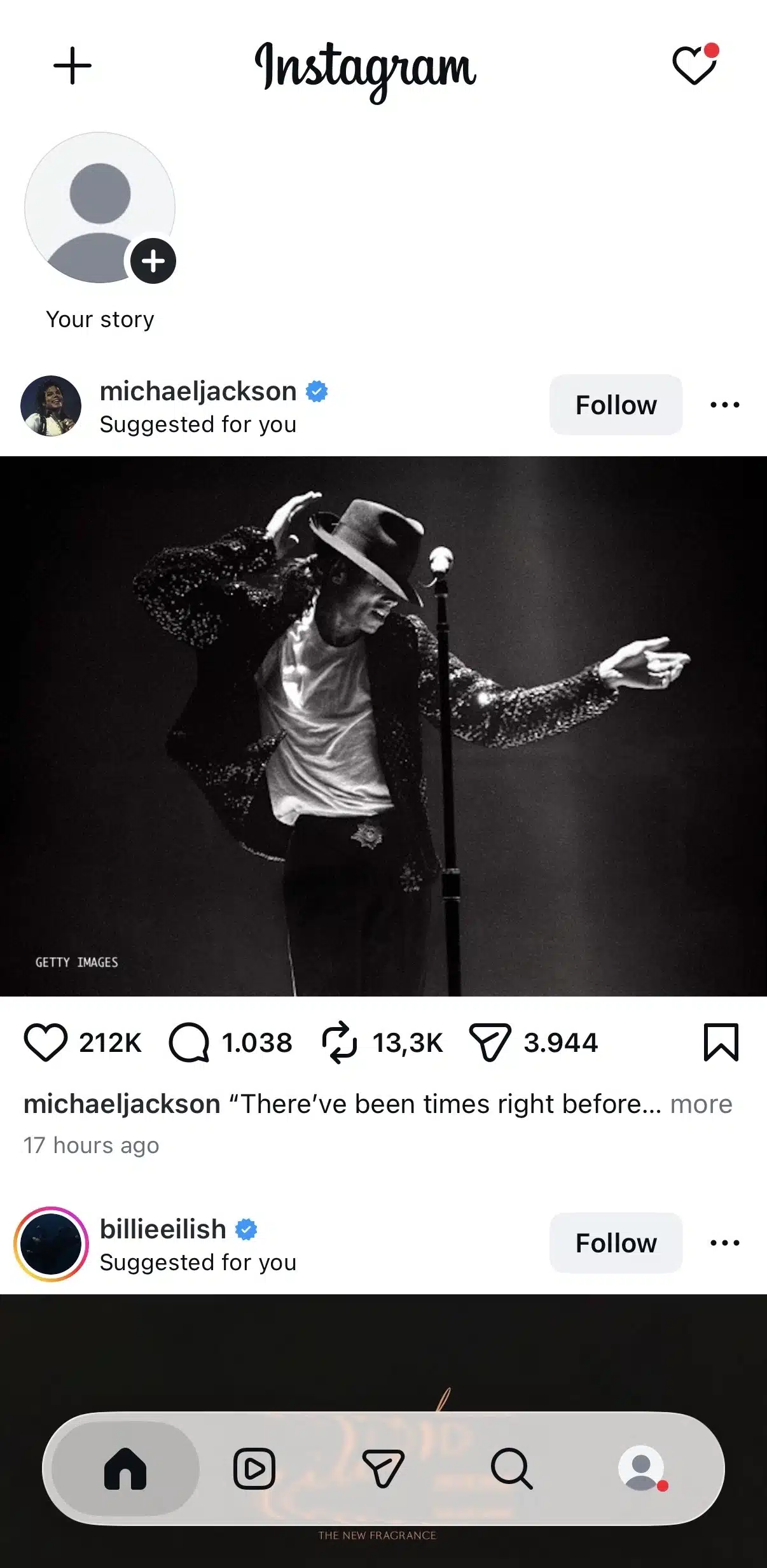 Instagram home feed displaying Stories at the top, followed by a suggested post from the verified Michael Jackson account. The interface includes engagement buttons for like, comment, share, and save, along with the bottom navigation bar where the Home tab is selected.