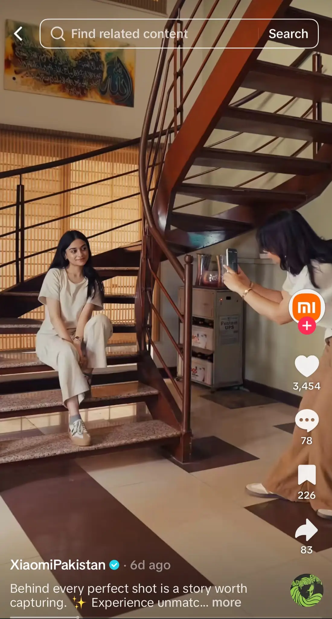 Person taking a photo of another person sitting on a staircase, showcasing a behind-the-scenes photography moment with a cinematic aesthetic.