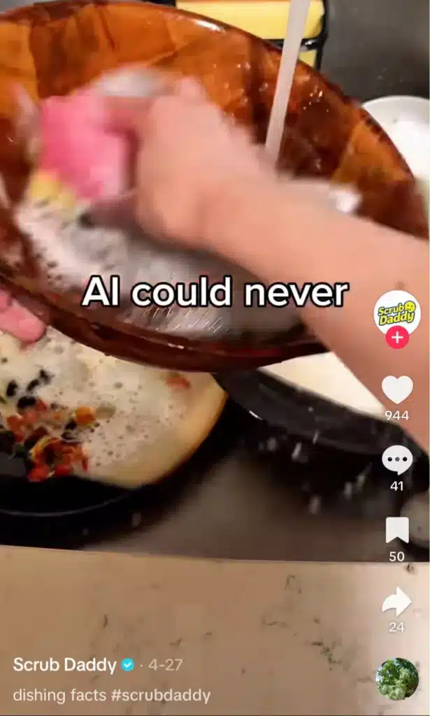 Scrub Daddy TikTok showing dishes being cleaned with the caption "AI could never" in a humorous product demonstration.