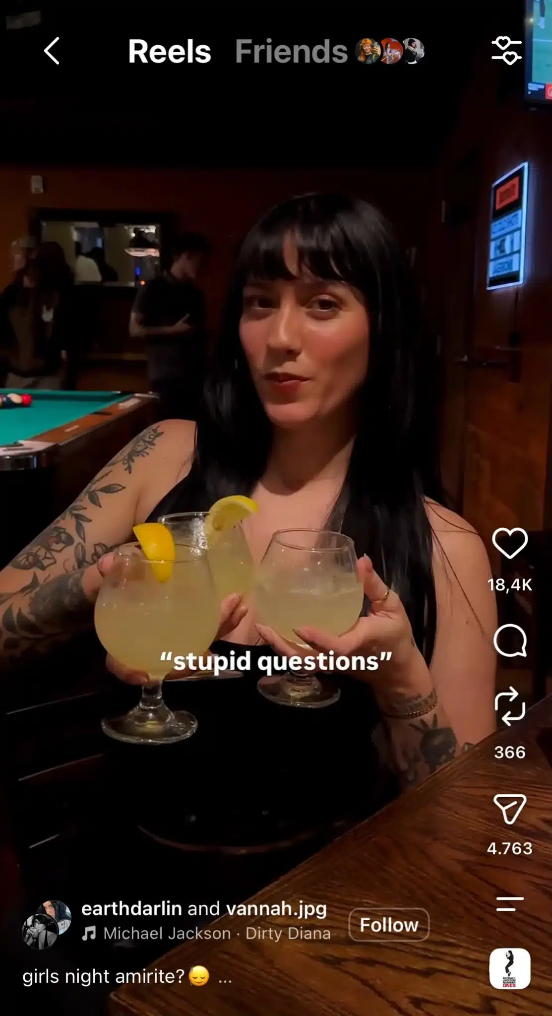 Instagram Reel showing a woman at a bar holding three cocktails, with the text “stupid questions” over the video.