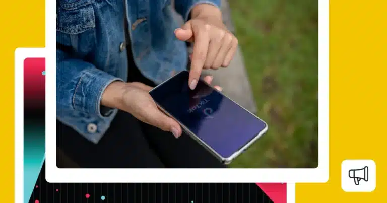 Graphic showing a person holding a smartphone with the TikTok app open, representing managing multiple TikTok accounts.