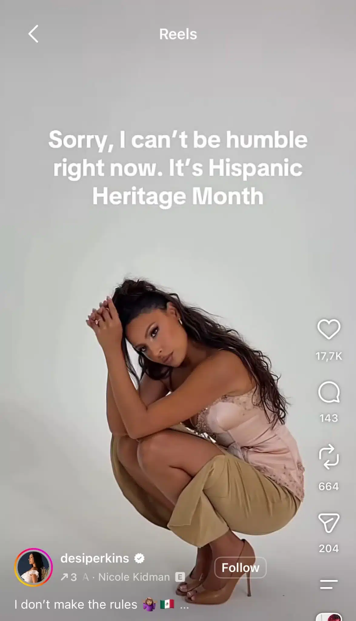 Instagram Reel from Desi Perkins posing during a photoshoot with text reading, “Sorry, I can’t be humble right now. It’s Hispanic Heritage Month.”