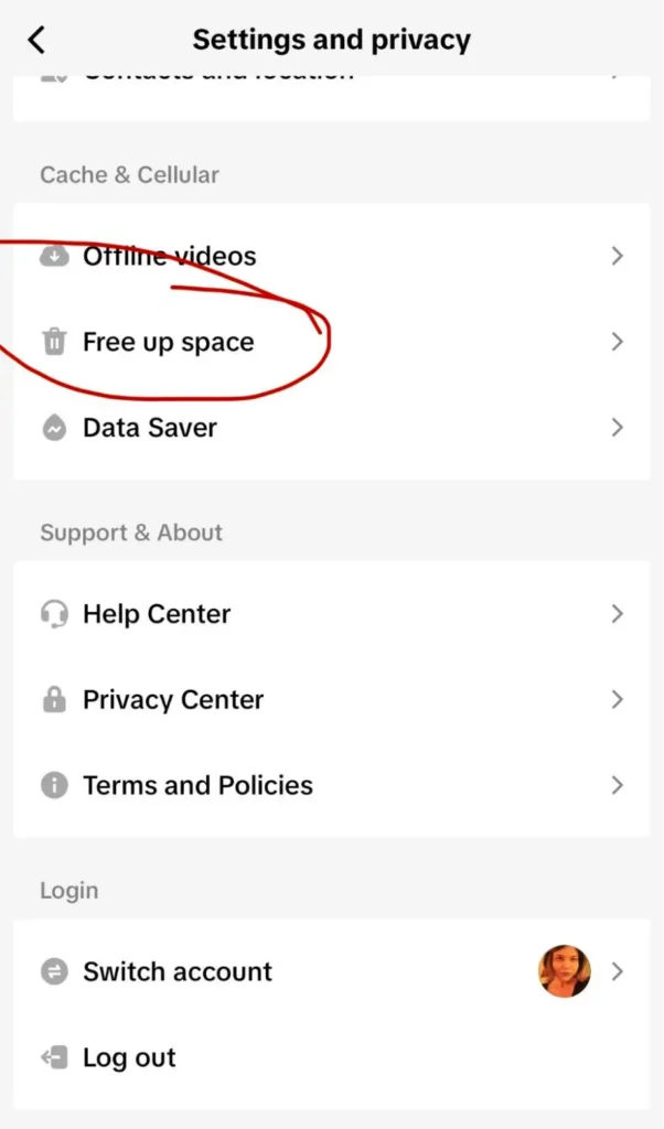 TikTok Settings and Privacy screen showing the “Free up space” option under Cache & Cellular, highlighted with a red circle.