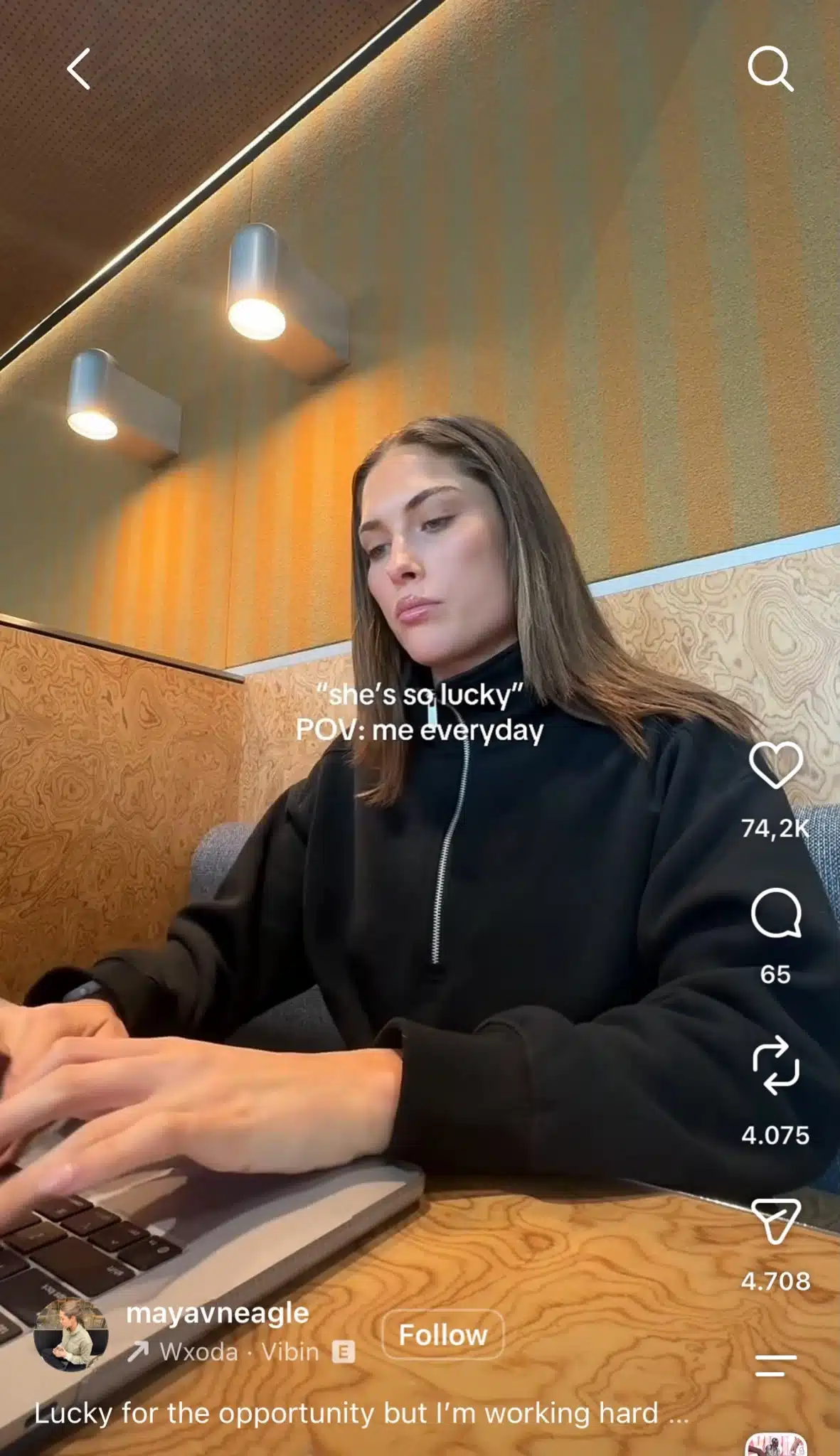 Instagram Reel showing a woman working on a laptop with text reading, “‘she’s so lucky’ POV: me everyday,” highlighting the work behind opportunities that may appear to be luck.