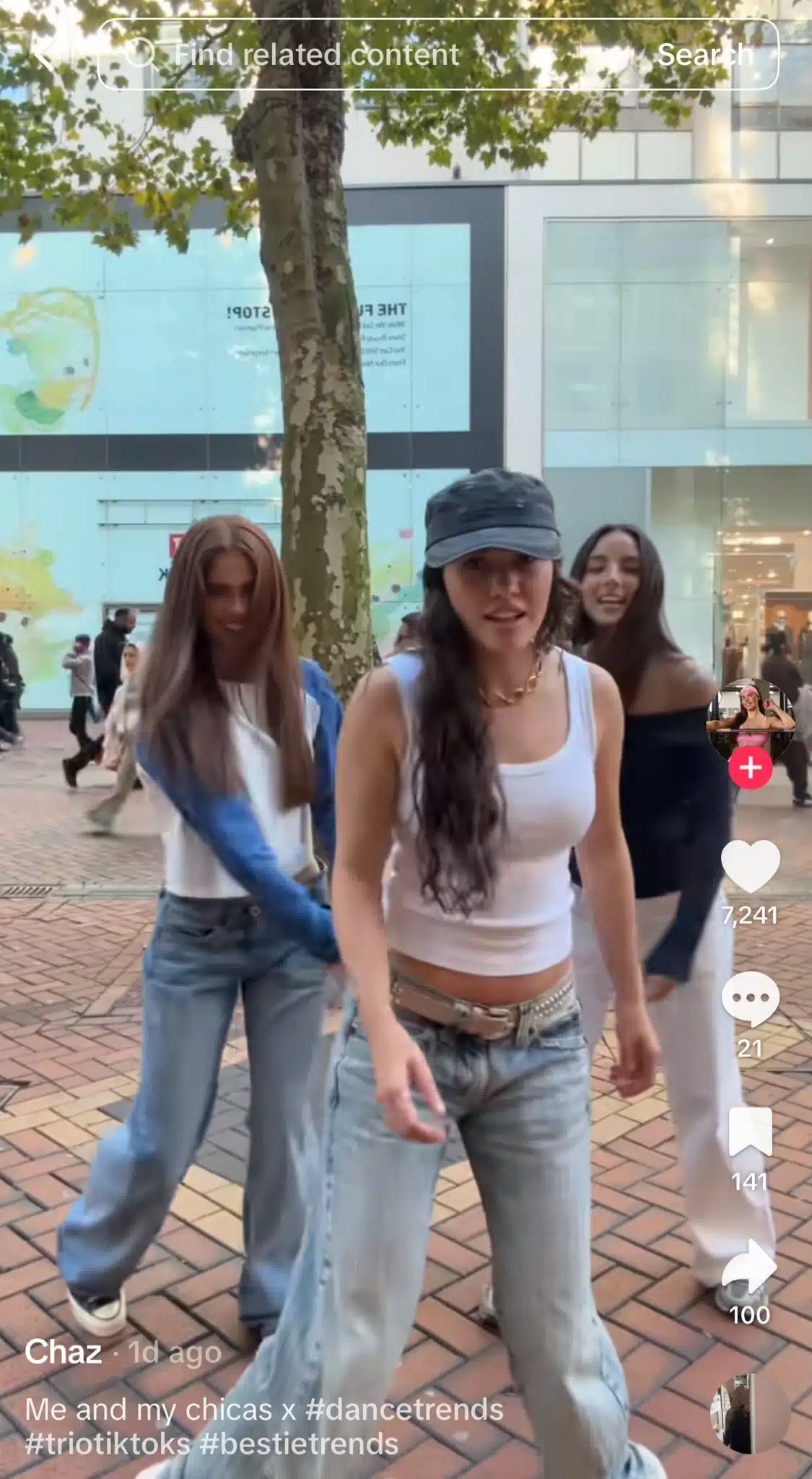 TikTok video showing three women performing a synchronized dance together outdoors.